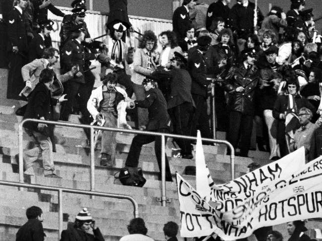 Police clash with Tottenham Hotspur supporters during the second leg of the UEFA Cup final, 1970s.