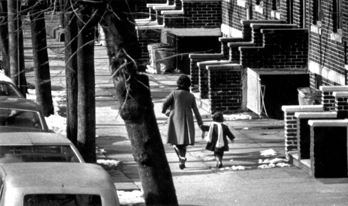 Mother and daughter walking on a street in Brooklyn, 1976.