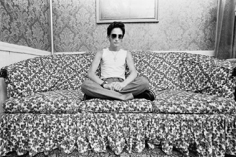 A man sitting on a couch, 1977.