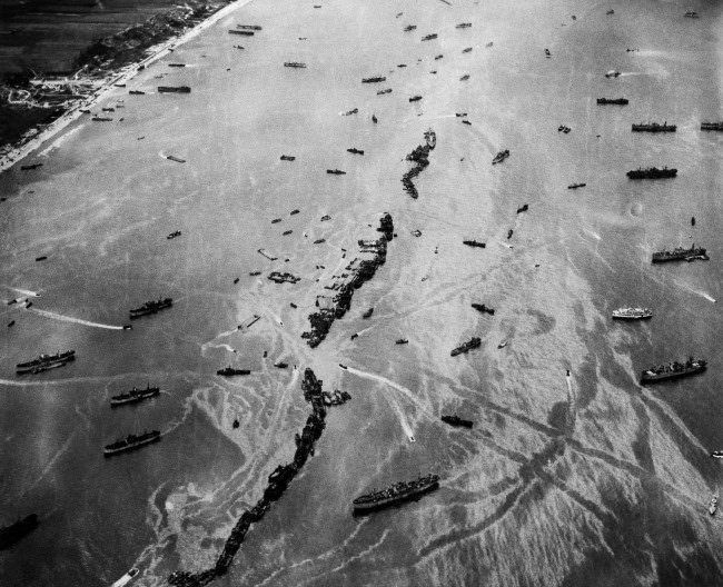 Thirteen Liberty ships, scuttled to form a breakwater for invasion vessels landing on the Normandy beachhead, 1944.