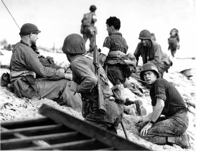 A first wave beach battalion Ducks lays low under the fire of Nazi guns on the beach of southern France on D-Day, 1944.