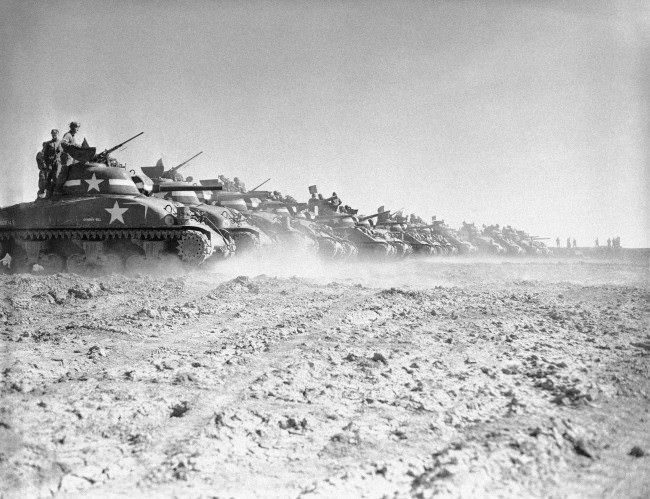 Men of a U.S. tank division practice with their General Sherman tanks on a range in England, 1944.