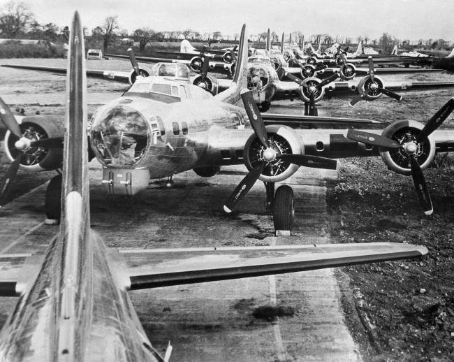 Long row of Flying Fortresses stand ready to be flown to combat units, 1944.