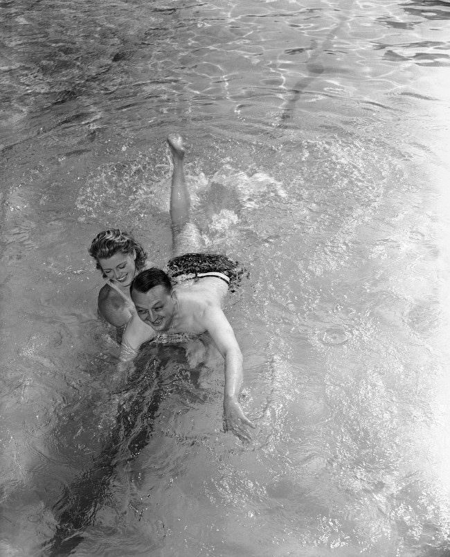 Larry Allen, Associated Press war correspondent who nearly drowned when the British Cruiser Galatea was torpedoed and sunk, takes his first swimming lesson in Miami, Florida. 1942