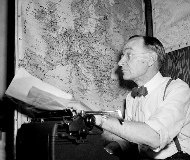 Kirk Simpson, Associated Press war analyst and Pulitzer Prize winner, retires to his typewriter and his maps to study the day’s war dispatches and report for Associated Press member newspapers. 1943