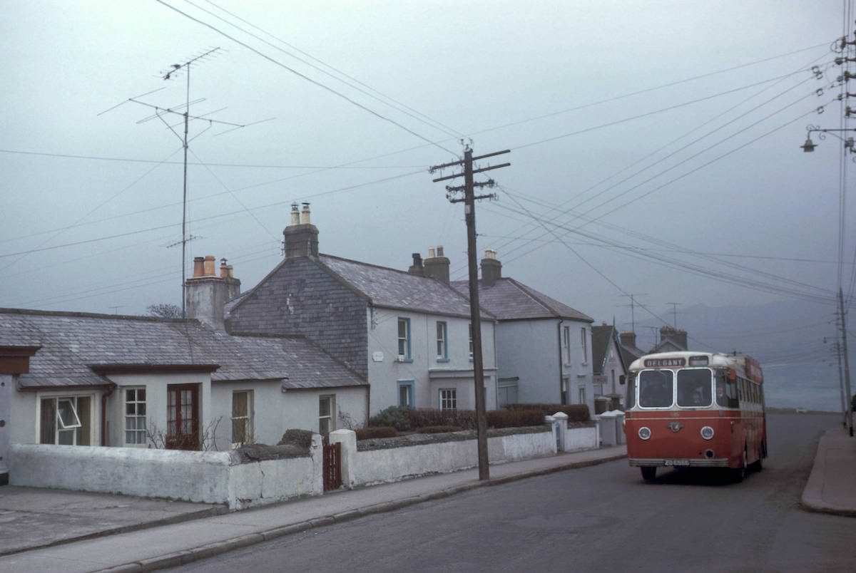 Bus on residential street, 1964