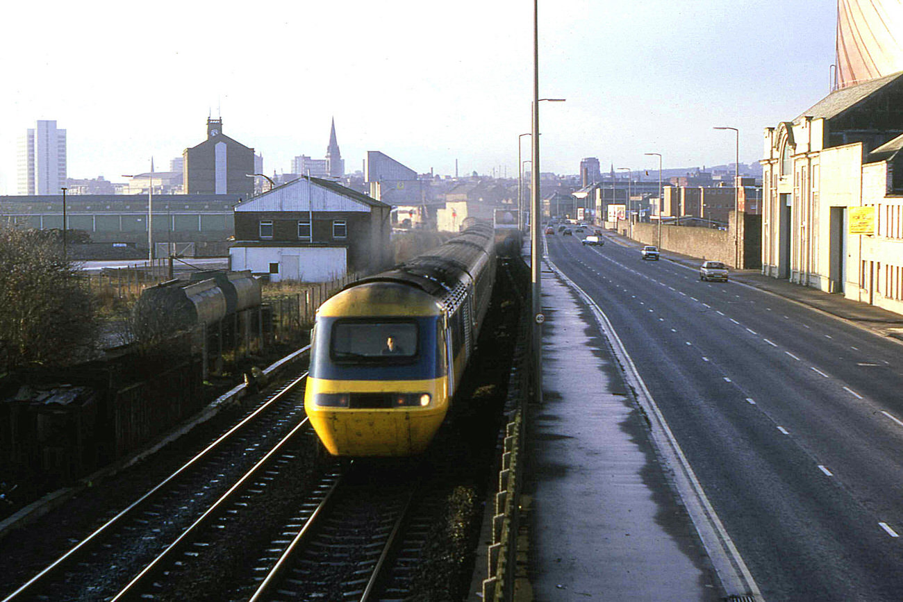 The 07:30 HST from Leeds to Aberdeen passes alongside East Dock Street as it heads north from Dundee on Christmas Eve 1985.