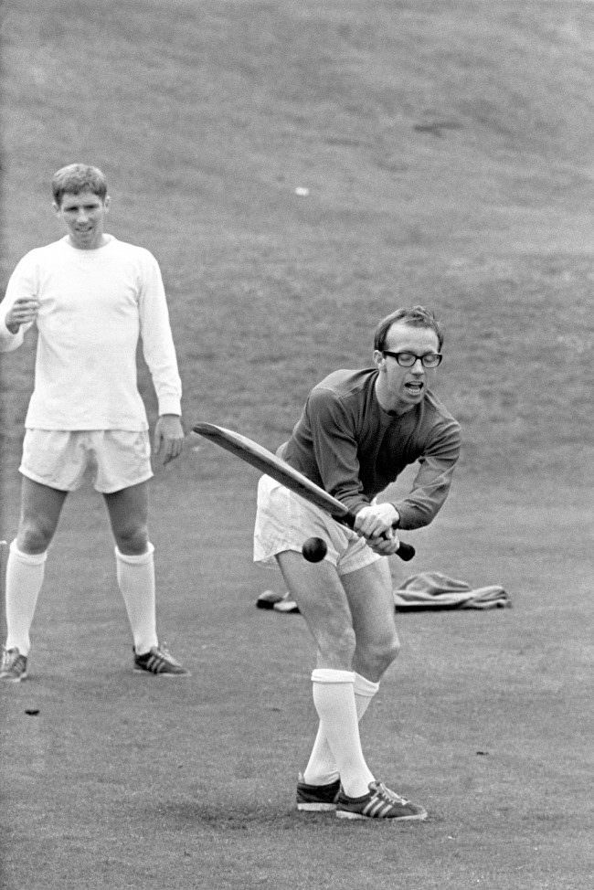 Nobby Stiles playing cricket, during England’s World Cup team’s preparation at Roehampton, London, before their semi-final match against Portugal at Wembley Stadium. Fielding in the picture is Alan Ball, 1966.