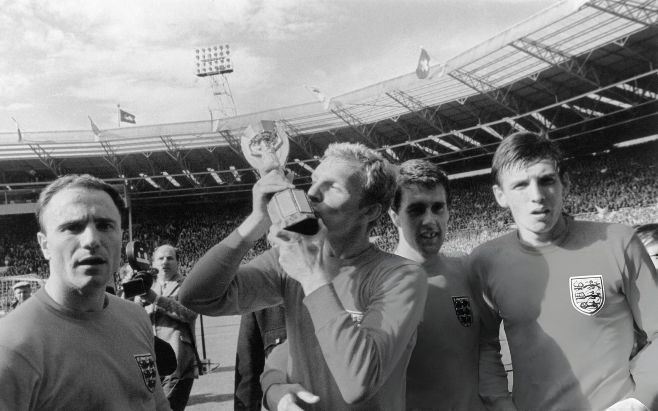 Bobby Moore kisses the Jules Rimet World Cup trophy after England's 4-2 win over West Germany, 1966.