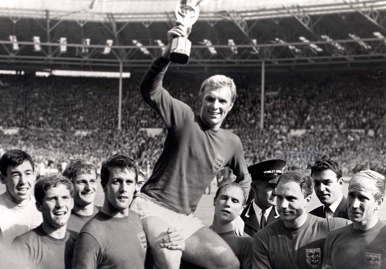 England's captain Bobby Moore holds aloft the Jules Rimet World Cup trophy, 1966.