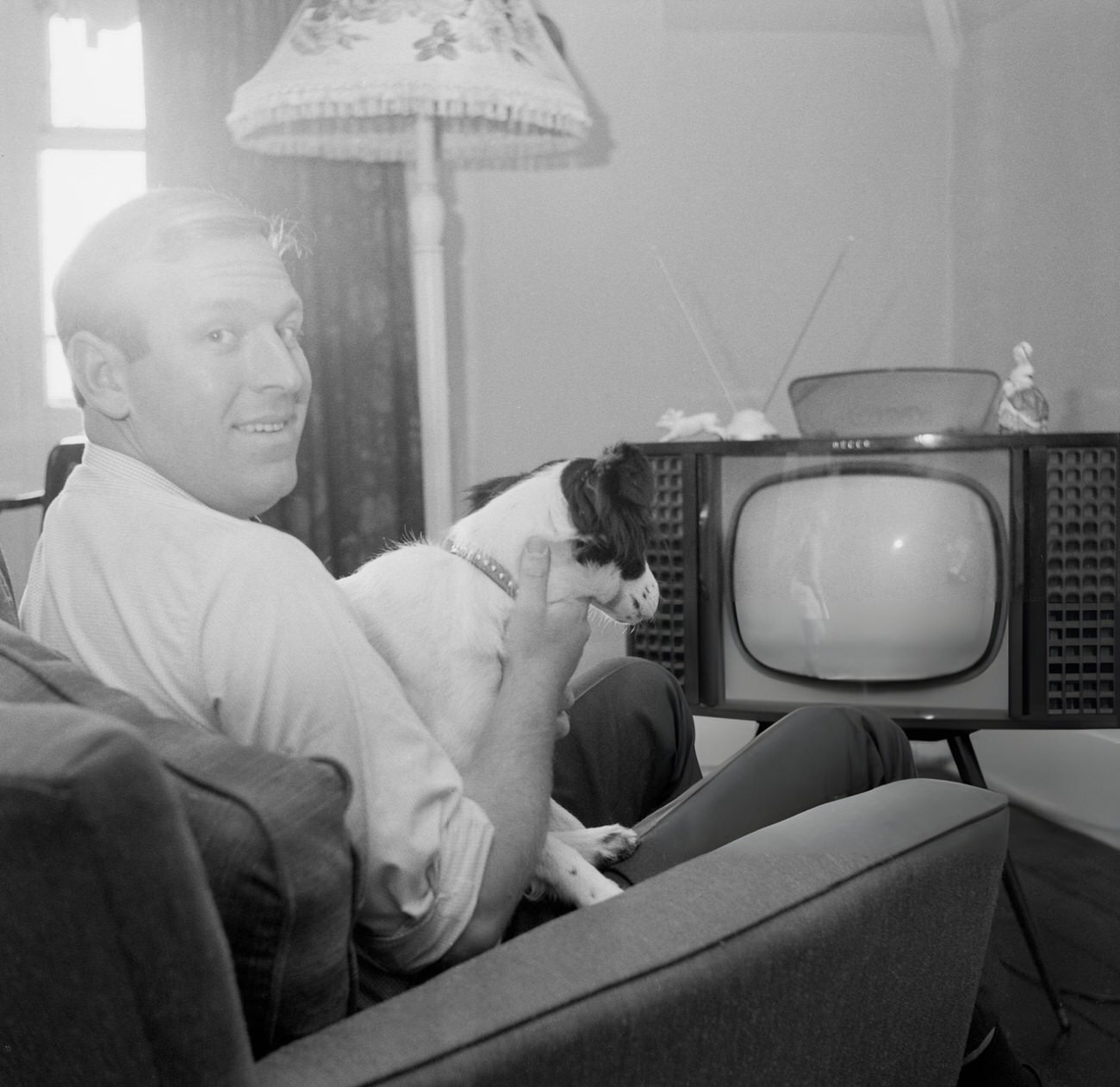 David Corbett and his dog Pickles watch the World Cup Final on TV, 1966.