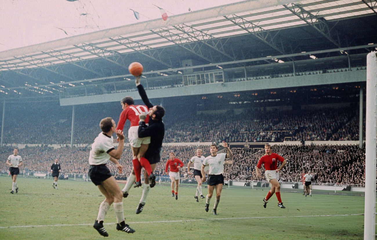 England player Geoff Hurst competes with the West German goalkeeper Hans Tilkowski, 1966.