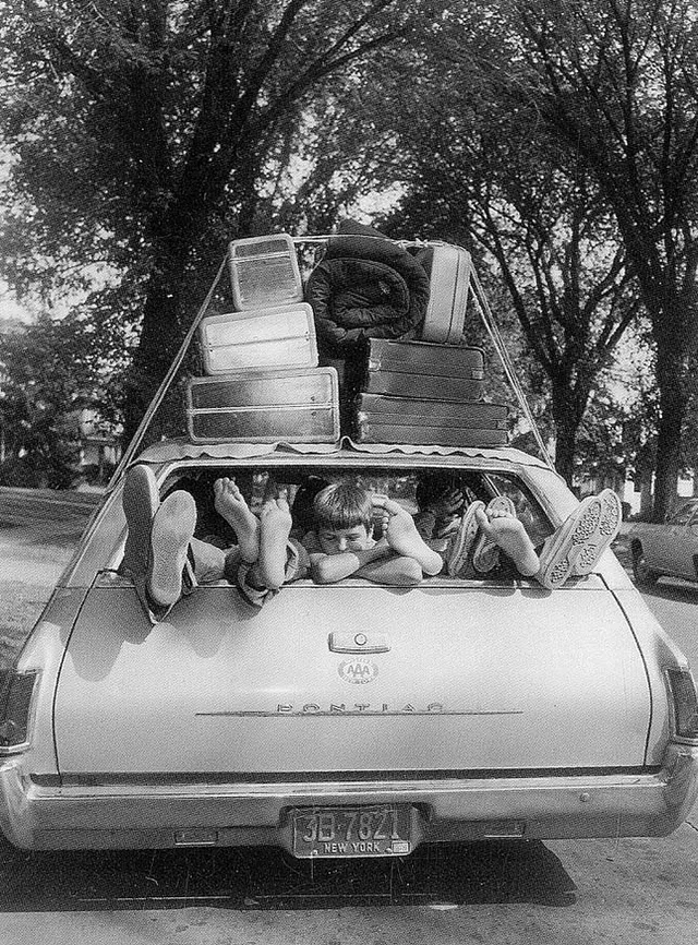 A family gets ready for a long trip.