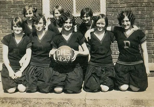 1920s flappers playing basketball.