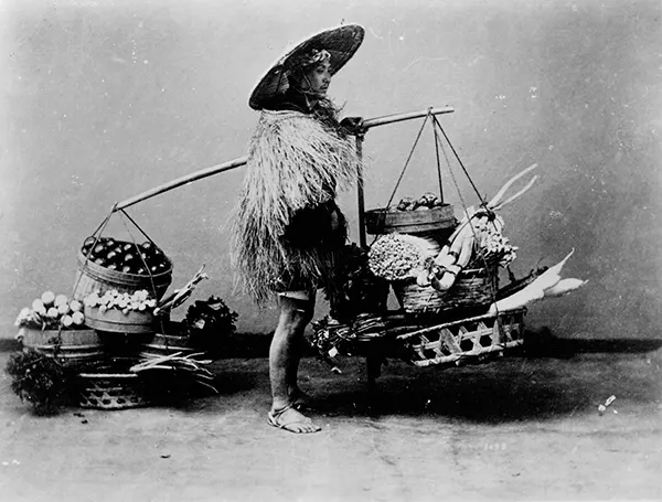 Man peddling vegetables, Japan, 1890-1923.