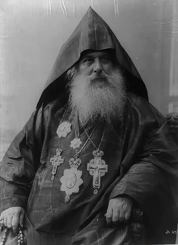 Patriarch Harootiun Vehabedian of the Armenian church wearing hood, robe and five medals, 1880-1924.