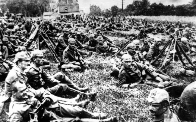 German soldiers resting near Ypres, Belgium on the way to the Flanders battle front during World War I.