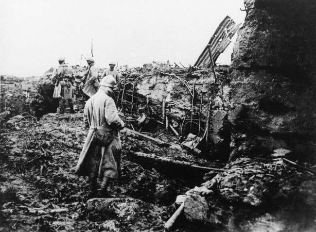 A reinforced German concrete shell shelters in Belgium being inspected by French officers after the Franco-British drive on Oct. 28, 1917.