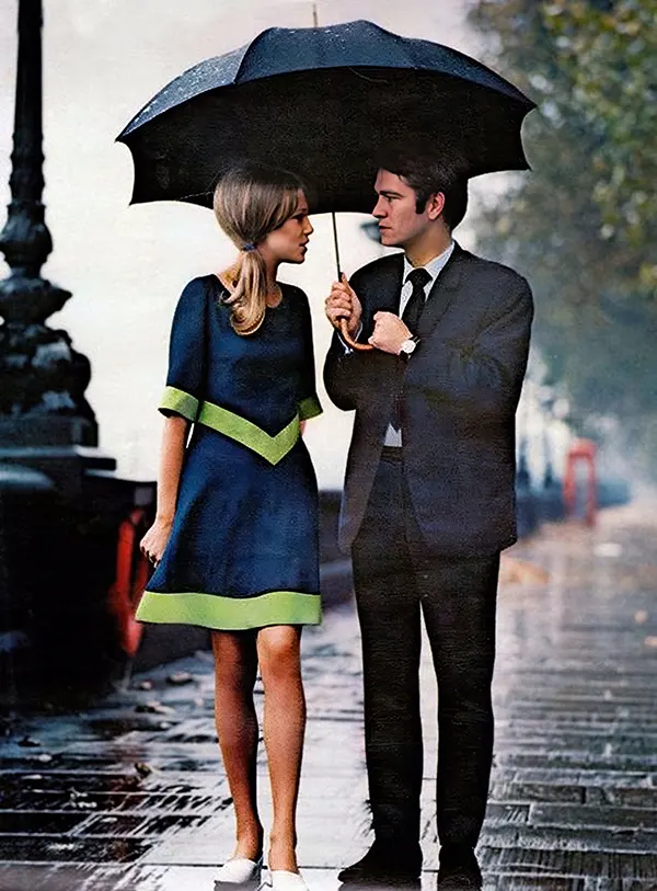 A stylish couple enjoying the romantic rain in London, 1963.