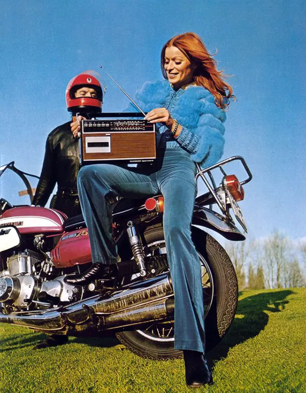 A 1970s biker girl cranking up some tunes.