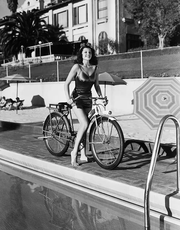 Rita Hayworth looking hot on her bicycle, 1940s.