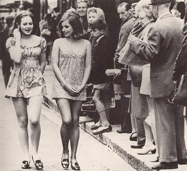 Two girls walking down the street in Cape Town, 1965.