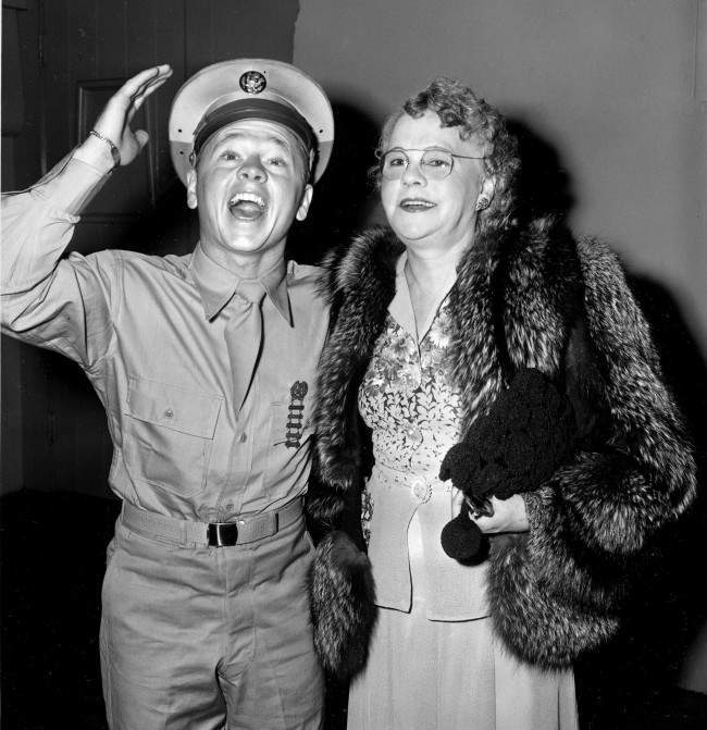 Pvt. Mickey Rooney attends a Hollywood movie premiere with his mother, Nell Pankey, on Aug. 17, 1944. The actor is back in Hollywood after completing three months of basic training at Fort Riley, Kansas.