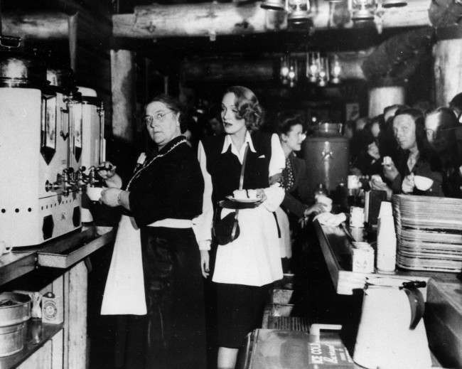 Mrs. Alleta Sullivan, left, mother of the five Sullivan brothers who lost their lives in the sinking of the cruiser USS Juneau, works alongside actress Marlene Dietrich as they serve servicemen in the United Service Organizations (USO) Hollywood Canteen, Ca., Feb. 9, 1944.