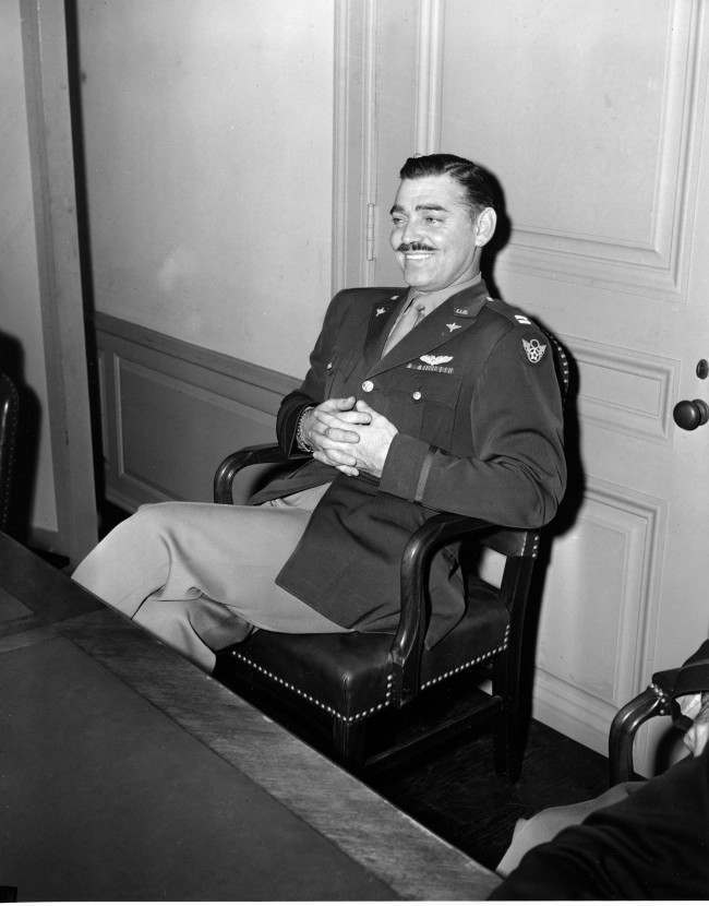 Capt. Clark Gable, erstwhile film actor, faced the press in the Pentagon in Washington, Oct. 27, 1943. Gable flew operational missions over Europe in B-17s to obtain combat film footage to be used for training purposes, and has just returned to the U.S.