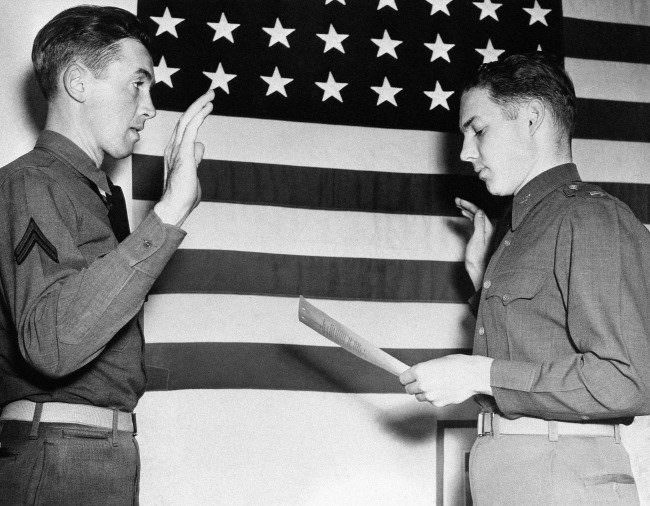 Lieut. E.L. Reid, personnel officer of the west coast training center at Moffett Field, California, right, swears in Jimmy Stewart, former movie star, as a second lieutenant in the Air Corps on Jan. 1, 1941. Stewart, who was one of HollywoodÂs most popular actors before he was inducted into the Army in 1941, was a corporal.