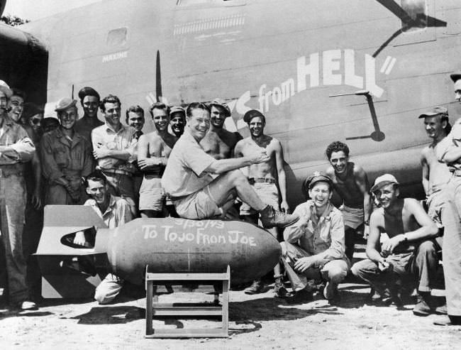 Film actor Joe E. Brown autographs a 1,000-pound bomb, ‘To Tojo from Joe,’ and says, ÂThere, boys, is the address with U.S. forces somewhere in New Guinea on April 15, 1943. Now go and deliver it. He is with the crew of the heavy B-24 bomber which is named Yanks from Hell.’