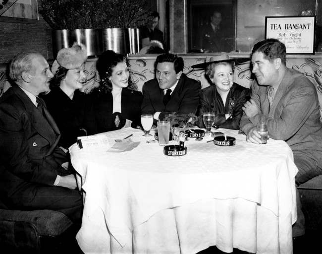 Writers and movie stars gather at New York’s Stork Club, March 8, 1942, as they prepare for a World War II Navy Relief Show, two days away, at Madison Square Garden.