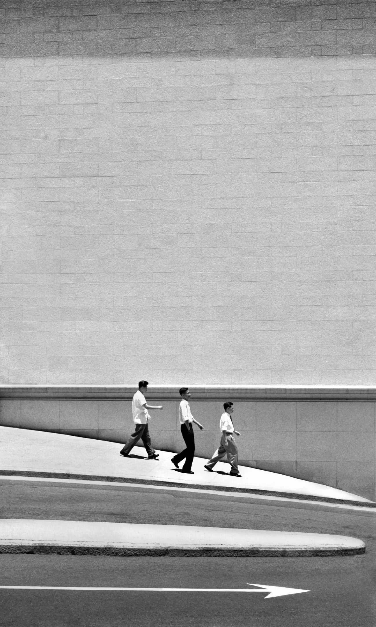 Three Men Walking, Hong Kong, 1960s.