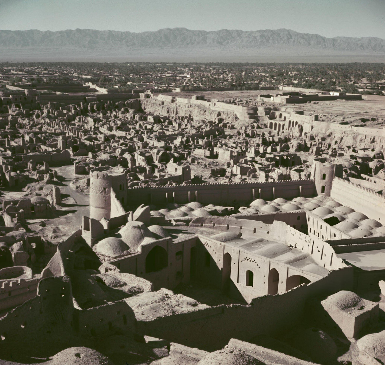 An aerial view of the ruins of the Arg-e Bam mudbrick fortress and citadel in the city of Bam in Kerman Province, Iran, circa 1960.