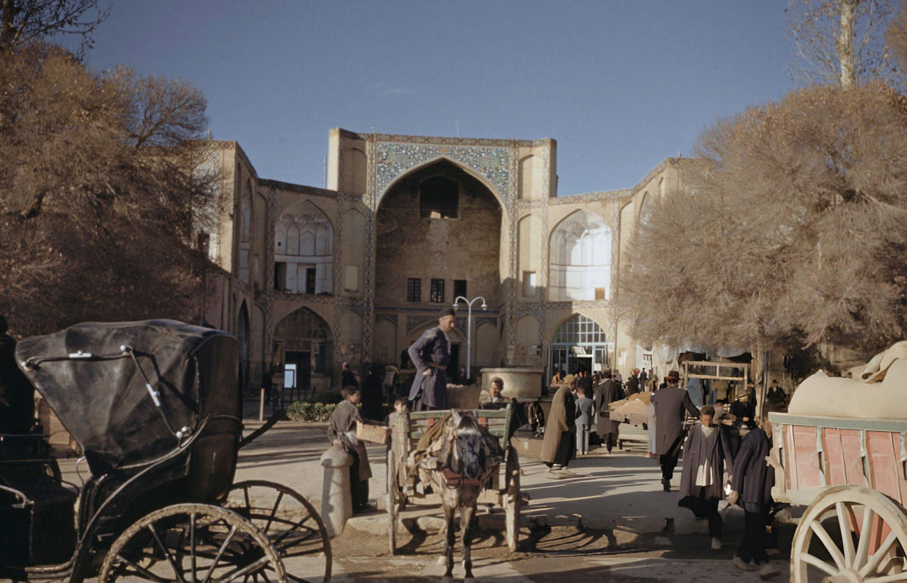 Traders' carts unloaded outside the entrance to the bazaar in Isfahan, in the Isfahan Province of Iran, circa 1960.