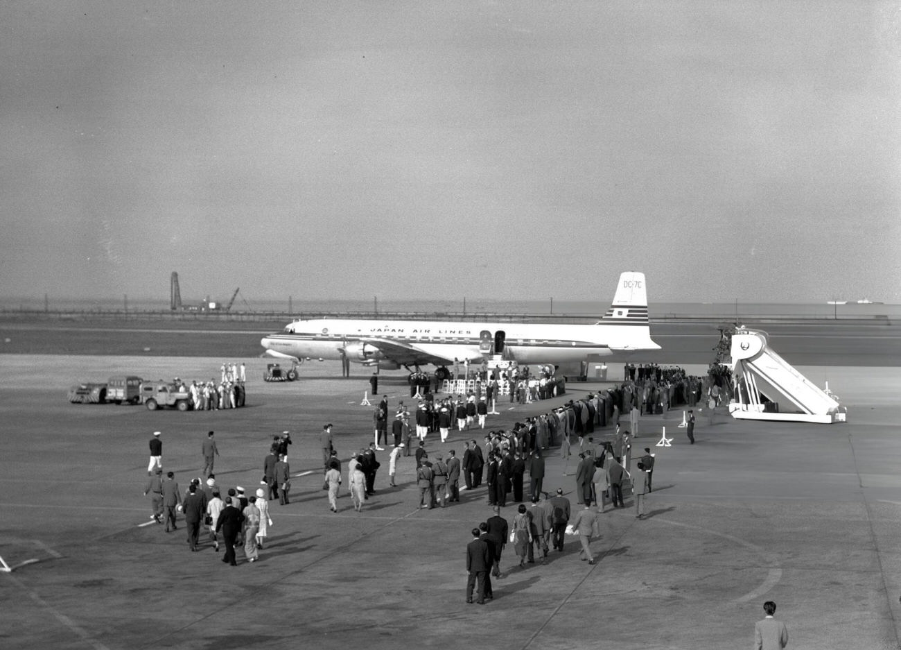 Crown Prince Akihito and Crown Princess Michiko depart for Iran, Ethiopia, India, and Nepal at Haneda Airport, Tokyo, 1960.