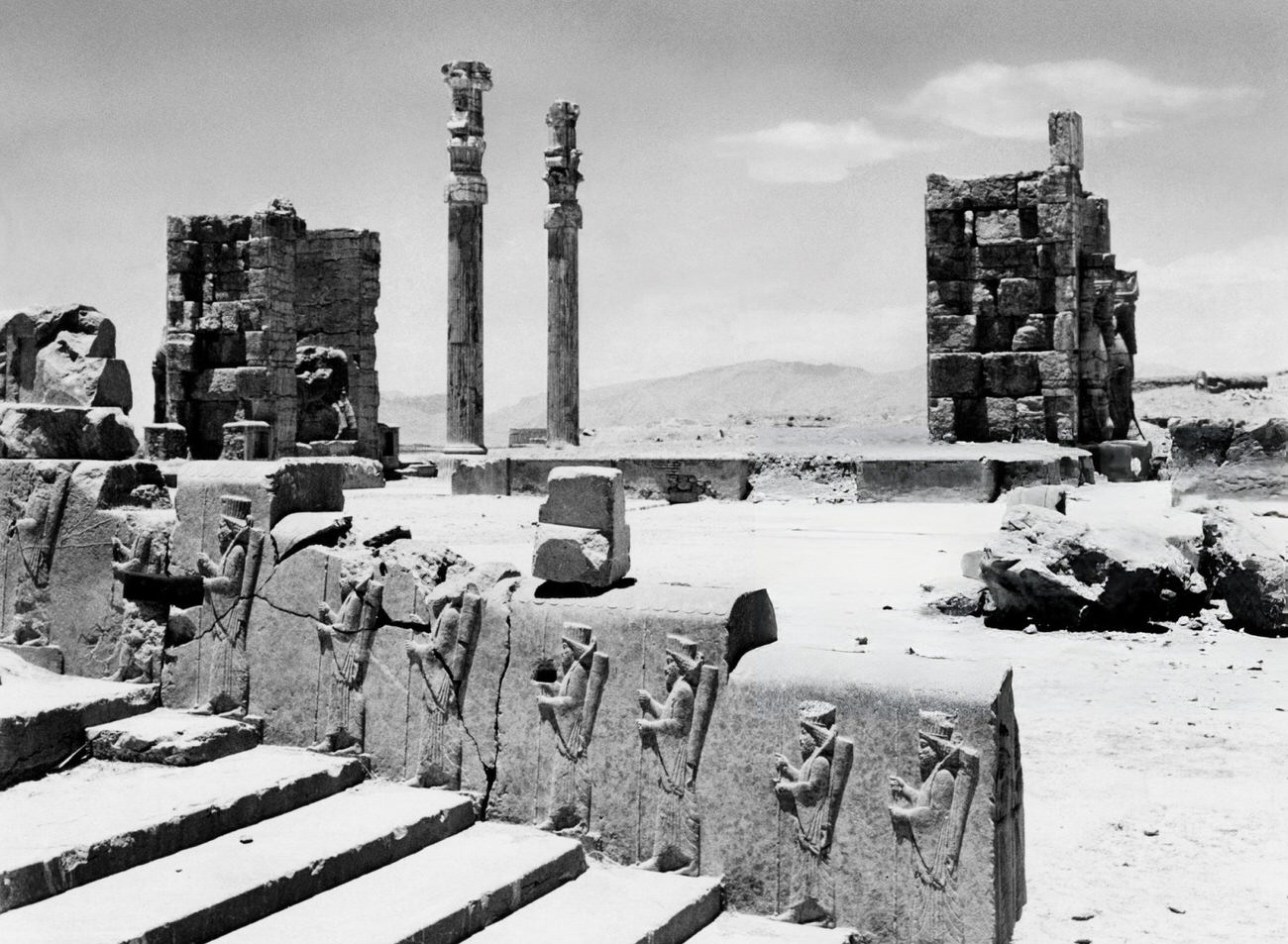 The stairway of King Darius depicted with his servants at the ruins of Persepolis, 1963.