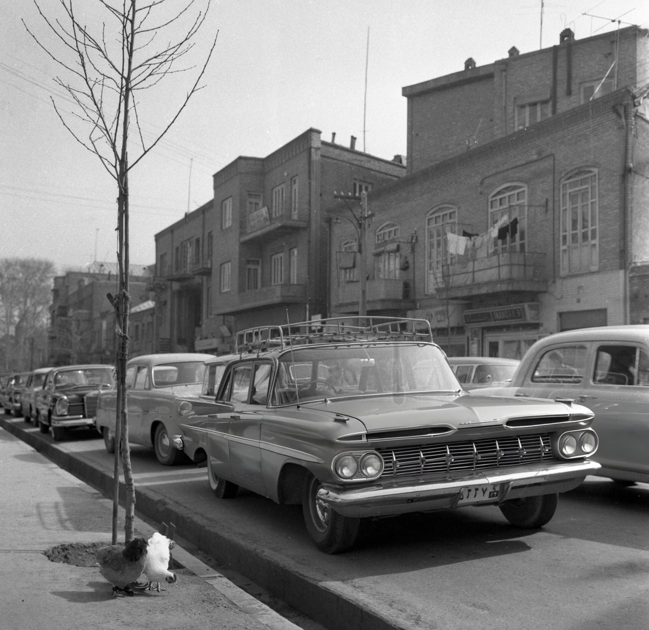 An American 'Chevrolet' car on the streets of Tehran, Iran, 1964.