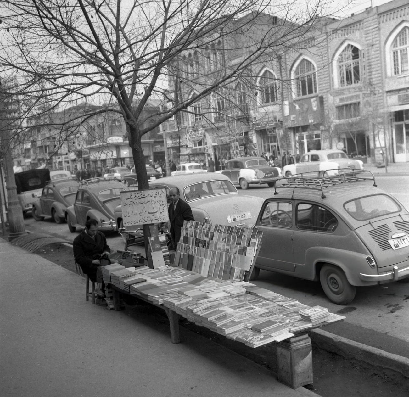 A book seller on a street in Tehran, Iran, 1964.