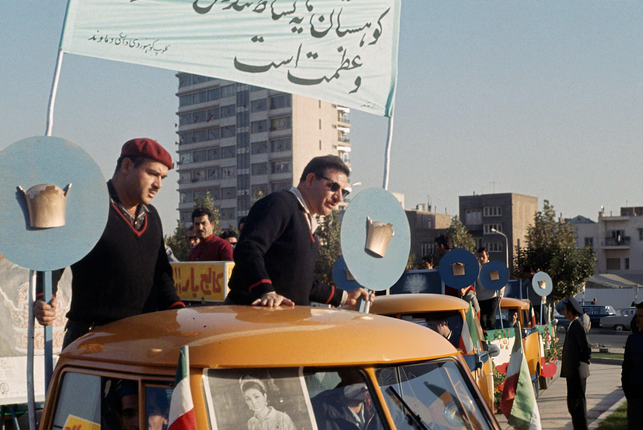 Cars decorated with flags and crowns in preparation for the coronation of Shah Mohammed Reza Pahlavi, Tehran, Iran, 1967.