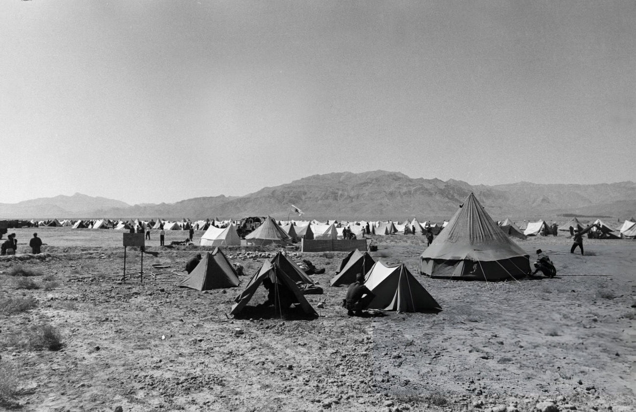 A view of some of the camps set up by the Imperial Army and the Red Lion and Sun Society to shelter the earthquake victims in Khorasan Province, Iran, 1968.