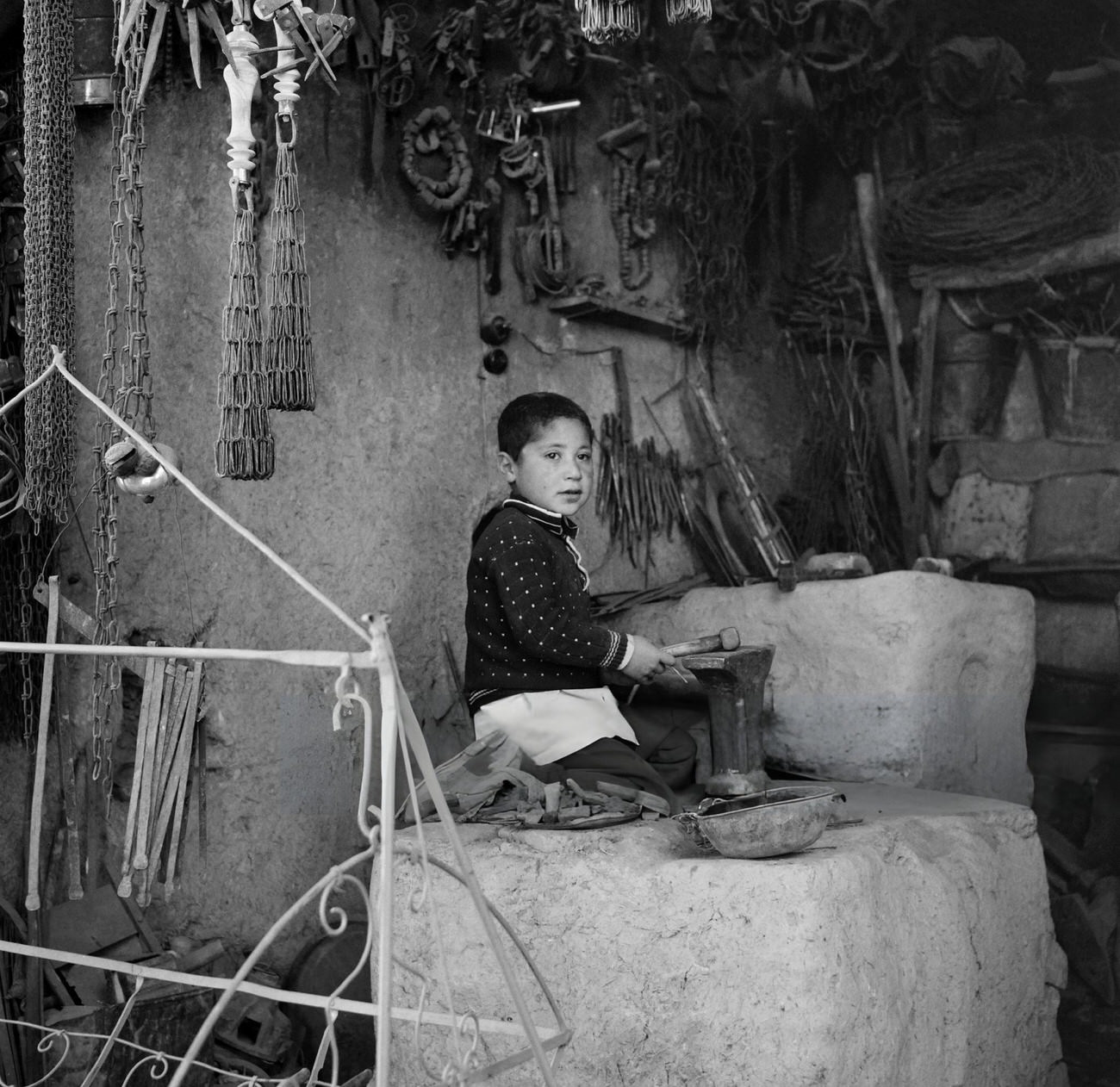 A child plays in a workshop in Tehran, Iran, 1968.