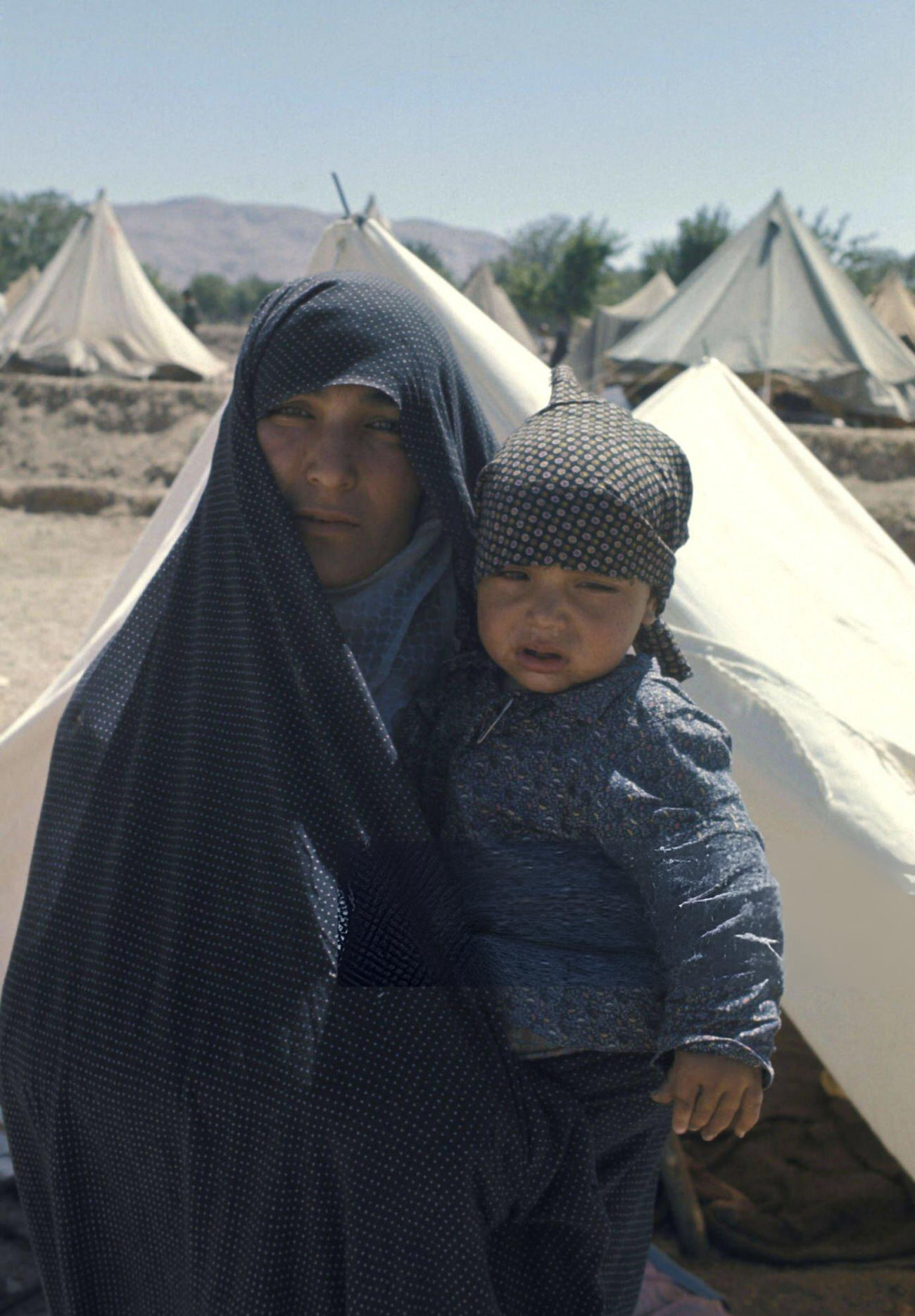 Refugees in one of the camps set up by the Imperial Army and the Red Lion and Sun Society to shelter the earthquake victims in Khorasan Province, Iran, 1968.