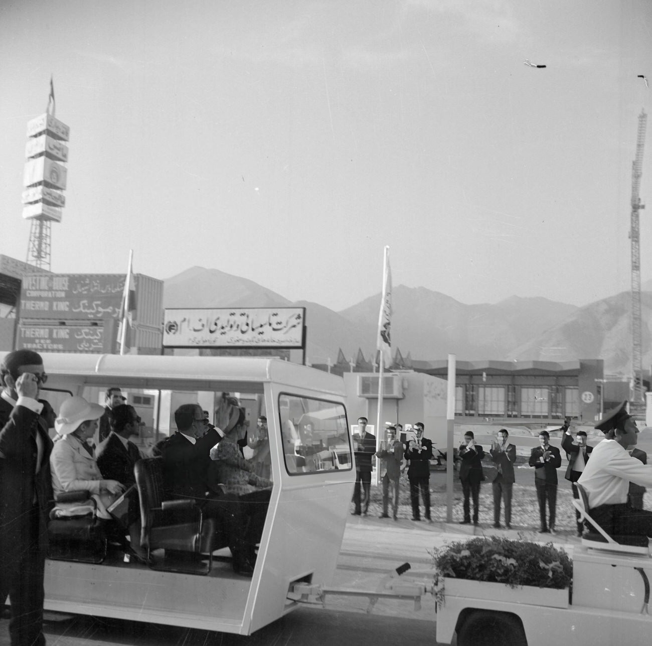 Mohammad Reza Pahlavi, the former Shah of Iran, and Empress Farah Pahlavi, at the Asian Trade International Exhibition of Industries and Manufacturing in Tehran, Iran, 1969.