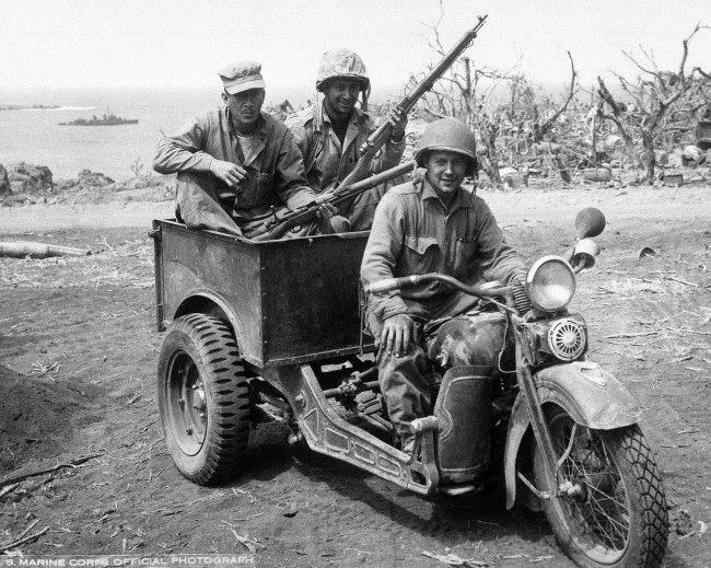 Japanese 3 wheel motorcycle repaired by U.S. Marines for own use. Photographed as action continued on Iwo Jima, Japan, 1945.