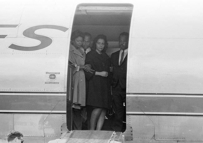 Coretta Scott King, widow of Dr. Martin Luther King, Jr., is comforted in the doorway of an airliner in Memphis, Tennessee, 1968.