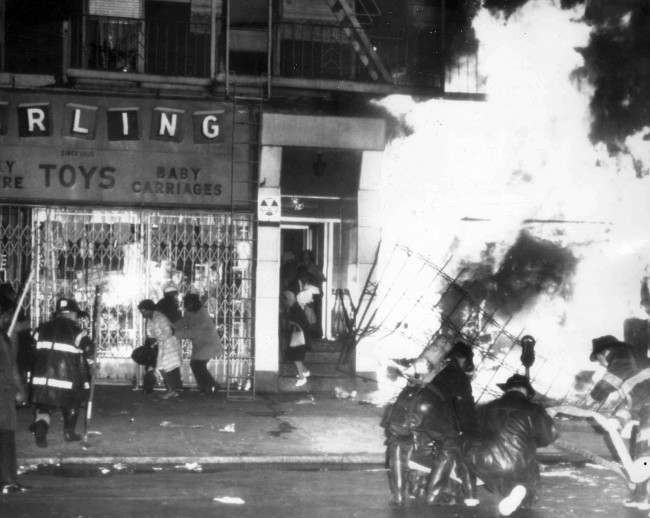 Firemen battle a blaze in Harlem, New York City, after Dr. Martin Luther King was assassinated in Memphis, 1968.