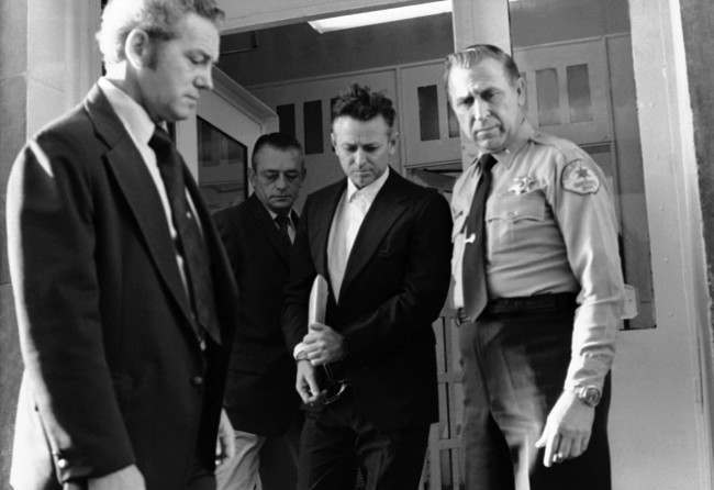 James Earl Ray leaves the Shelby County Jail escorted by US marshals and sheriff’s deputies enroute to the federal court in Memphis, Tennessee, 1974.