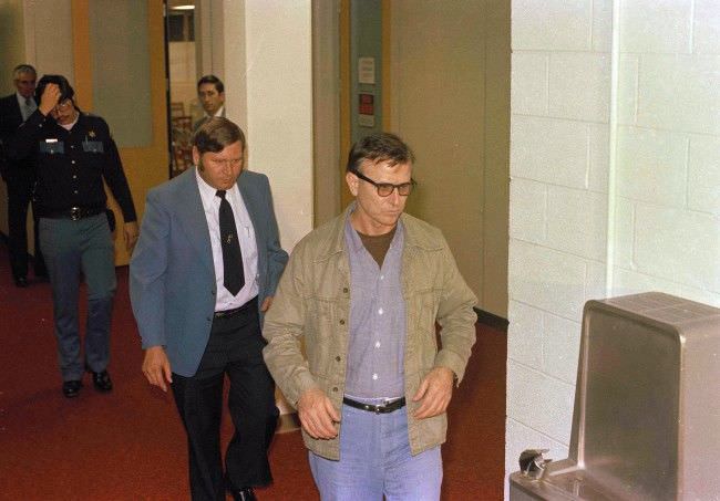 James Earl Ray, wearing jacket and tie, is shown at his escape trial in Tennessee, 1977.