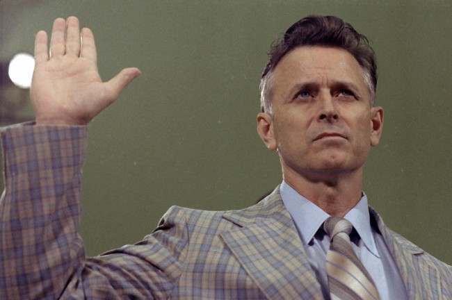 James Earl Ray, convicted killer of civil rights leader Dr. Martin Luther King Jr., is shown being sworn in prior to his testifying before the House Select Committee on Assassinations in Washington, 1978.